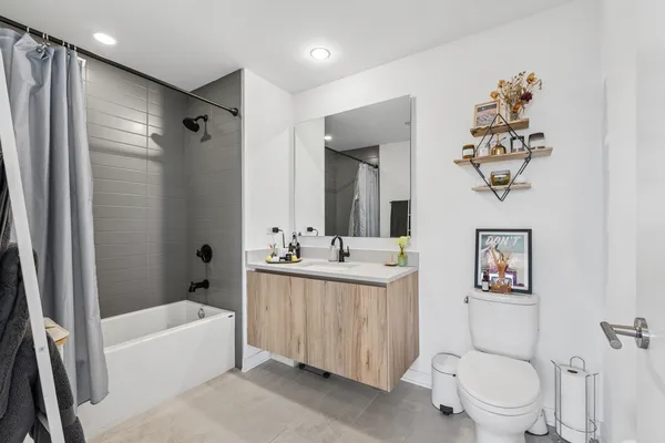 a bathroom with a sink a toilet and a bathtub