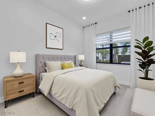 a bedroom with a bed and a couch