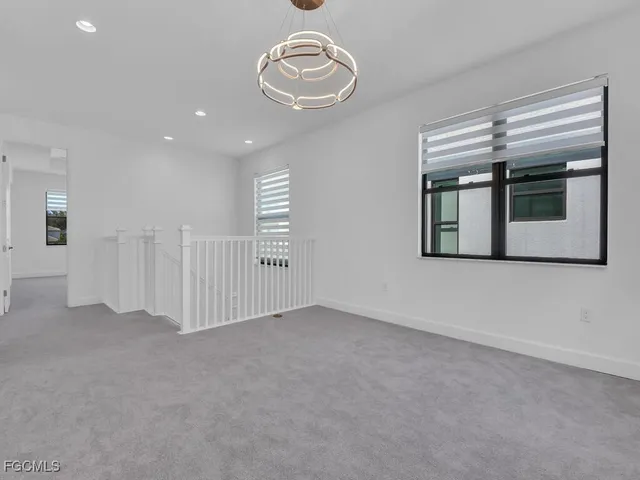 a bedroom with a bed and a chair