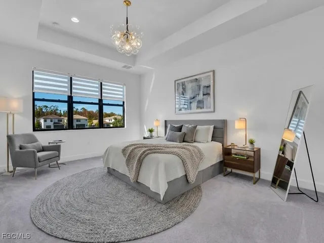 a bathroom with a granite countertop sink toilet and a mirror