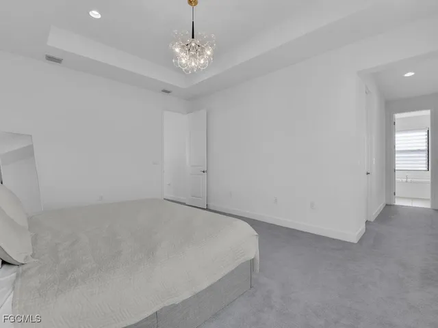 a view of a chairs and table in patio with a lake view