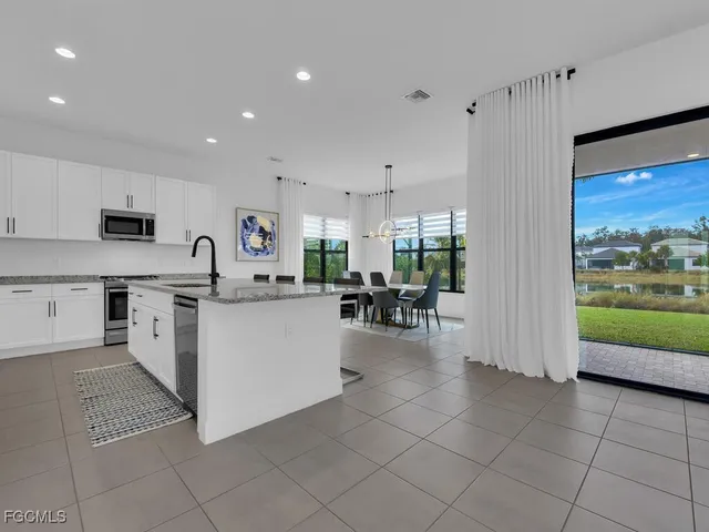 a view of a dining room with furniture window and outside view