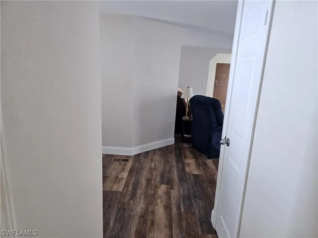 a view of bedroom with wooden floor