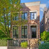 a view of a brick house with a large windows