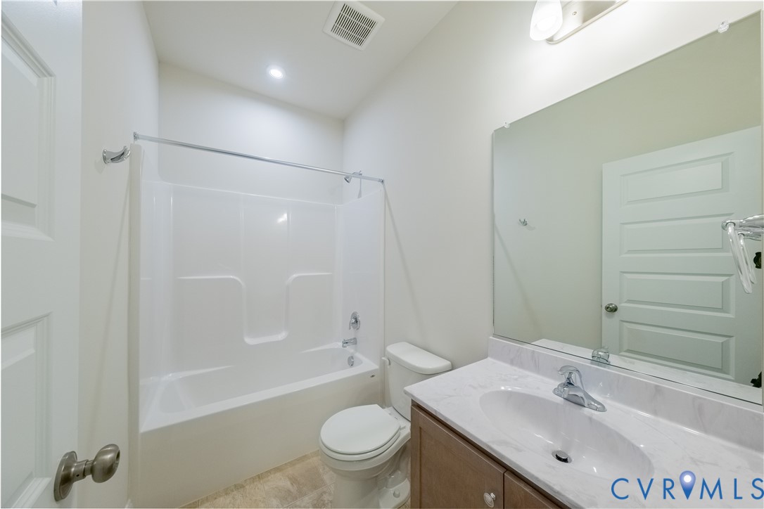 4368 Dominion Forest Circle Glen Allen, VA 23060 - Photo 18 of 36 a bathroom with a bathtub shower sink vanity mirror and toilet