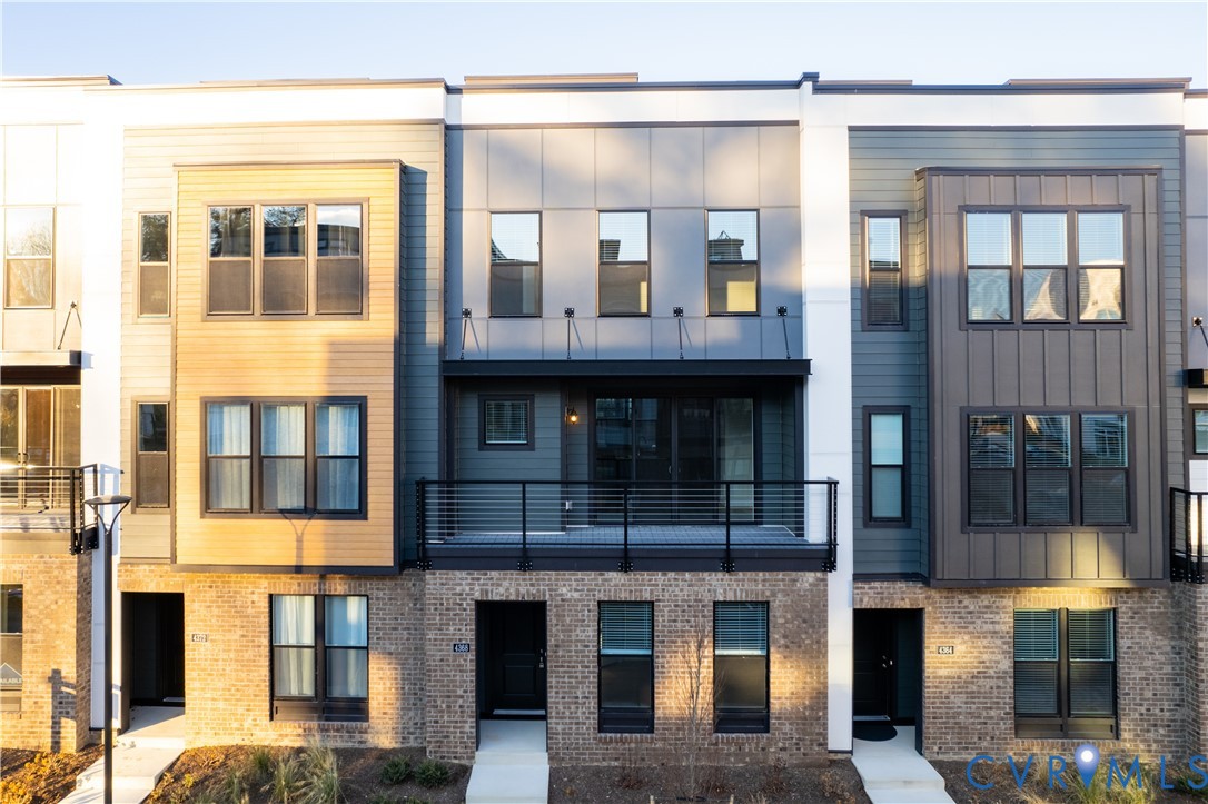 4368 Dominion Forest Circle Glen Allen, VA 23060 - Photo 2 of 36 a large building with a lot of windows