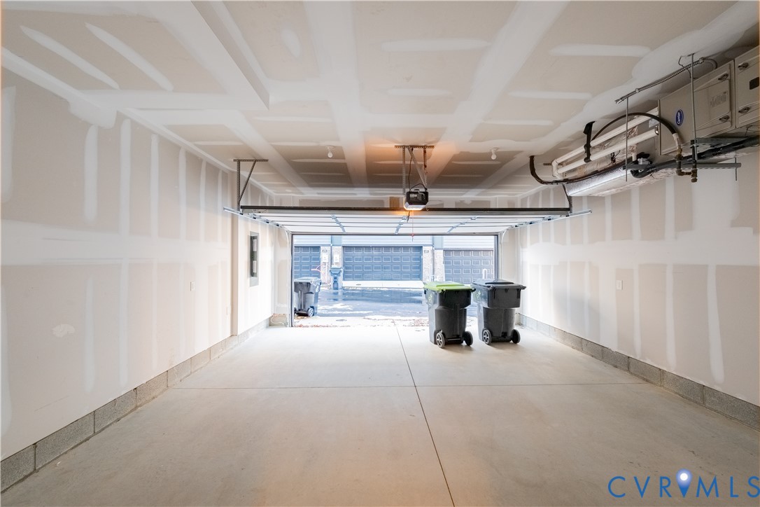 4368 Dominion Forest Circle Glen Allen, VA 23060 - Photo 7 of 36 a kitchen with a stove and white cabinets
