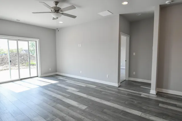 a view of an empty room with a window