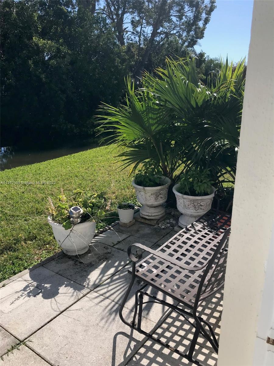 4565 Duhme Road, Unit 105 St. Petersburg, FL 33708 - Photo 16 of 19 a view of a backyard with sitting area