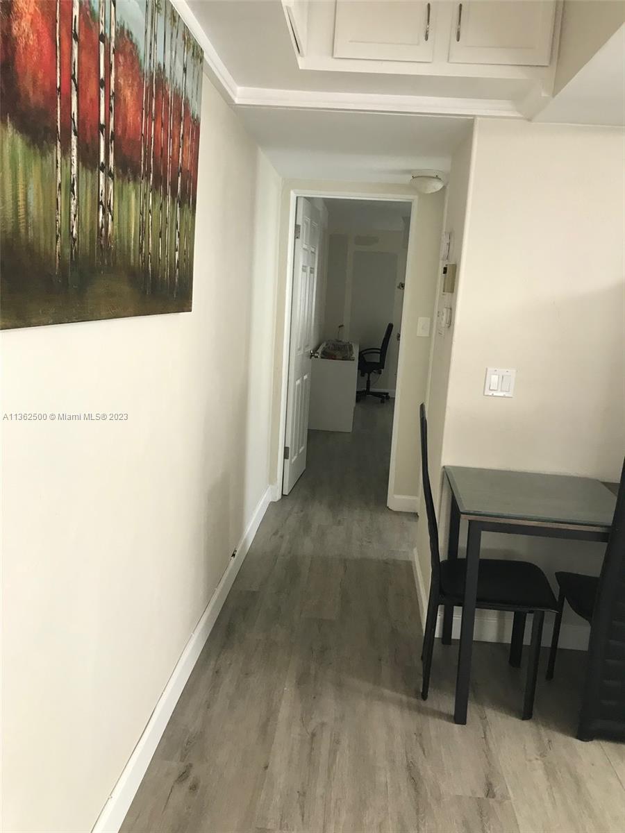 4565 Duhme Road, Unit 105 St. Petersburg, FL 33708 - Photo 3 of 19 a view of a hallway with a outdoor space
