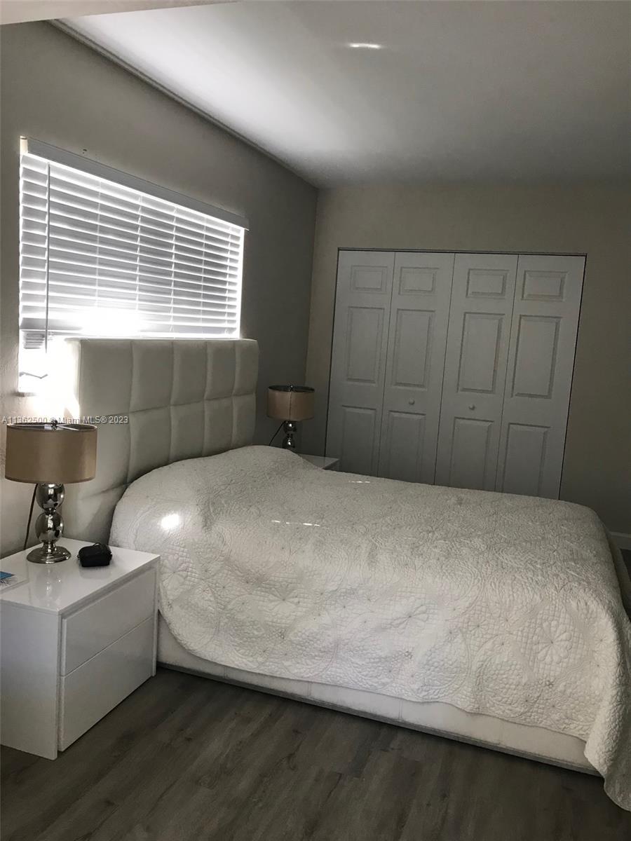 4565 Duhme Road, Unit 105 St. Petersburg, FL 33708 - Photo 8 of 19 a bedroom with a bed and window