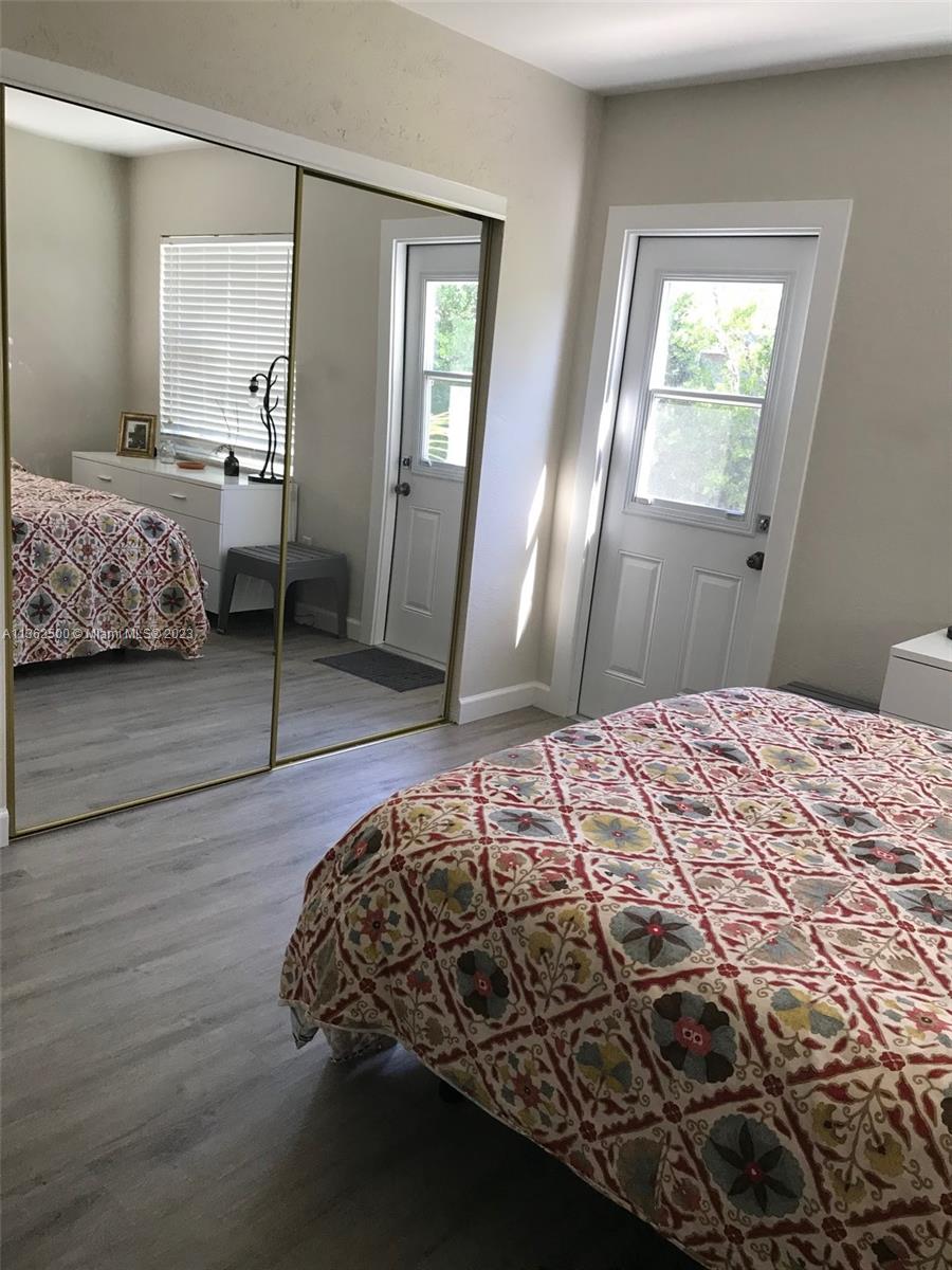 4565 Duhme Road, Unit 105 St. Petersburg, FL 33708 - Photo 10 of 19 a bedroom with a bed and window