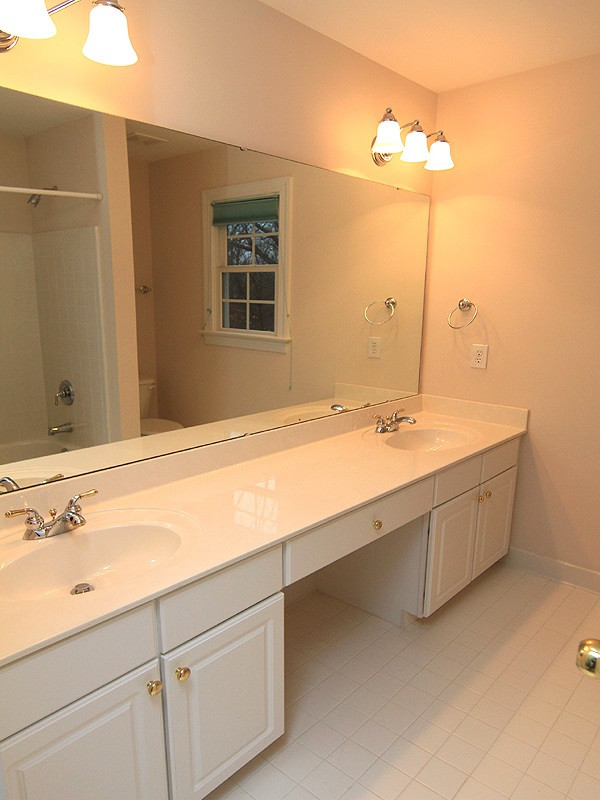 2937 Sunnystone Way Raleigh, NC 27613 - Photo 20 of 25 A large Double Vanity, an area for sitting & great lighting will welcome your guests. Guest Bath