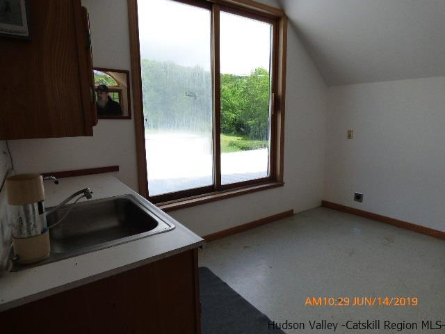 2199 Burroughs Memorial Road Roxbury, NY 12474 - Photo 21 of 34 a kitchen with a sink cabinets and a window