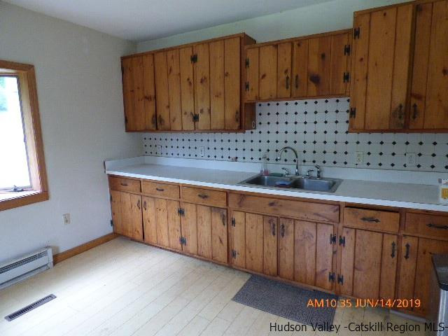 2199 Burroughs Memorial Road Roxbury, NY 12474 - Photo 26 of 34 a kitchen with wooden cabinets