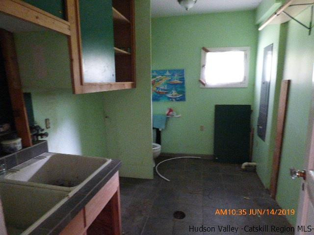 2199 Burroughs Memorial Road Roxbury, NY 12474 - Photo 27 of 34 a bathroom with a sink and a mirror