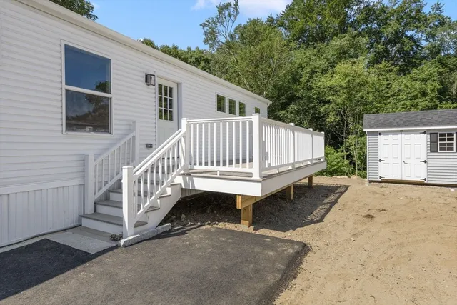 a view of backyard with deck and deck