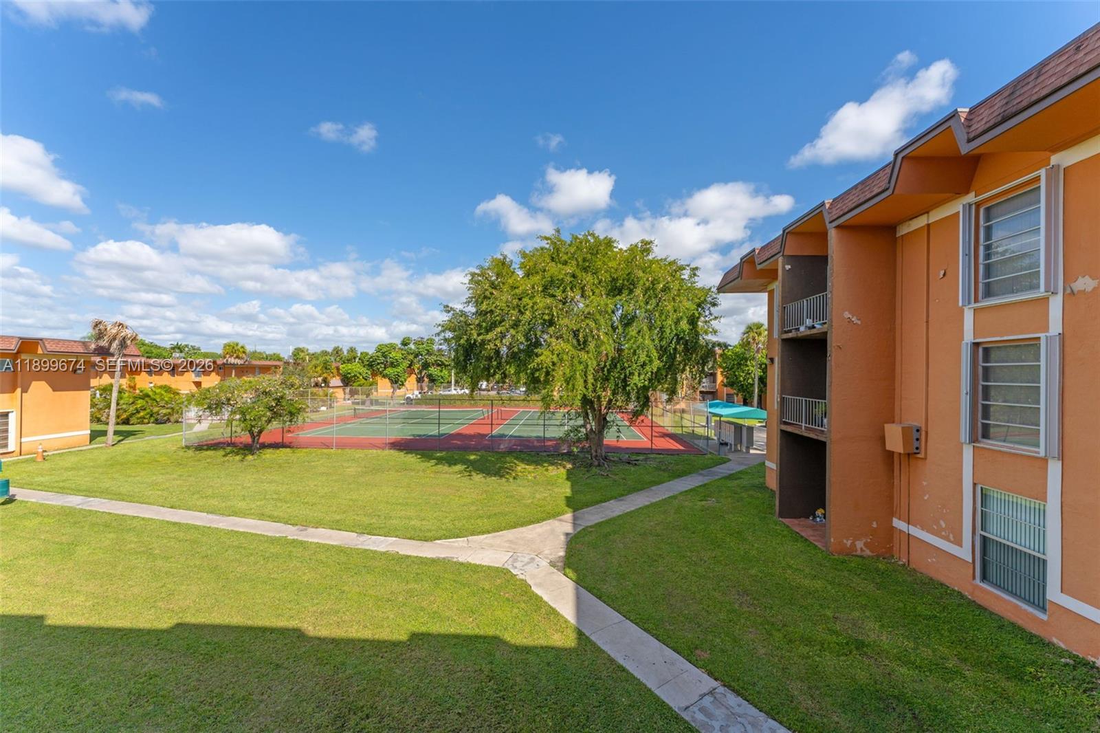 9437 Southwest 76th Street, Unit V25 Miami, FL 33173 - Photo 21 of 30 a view of an outdoor space pool patio and yard
