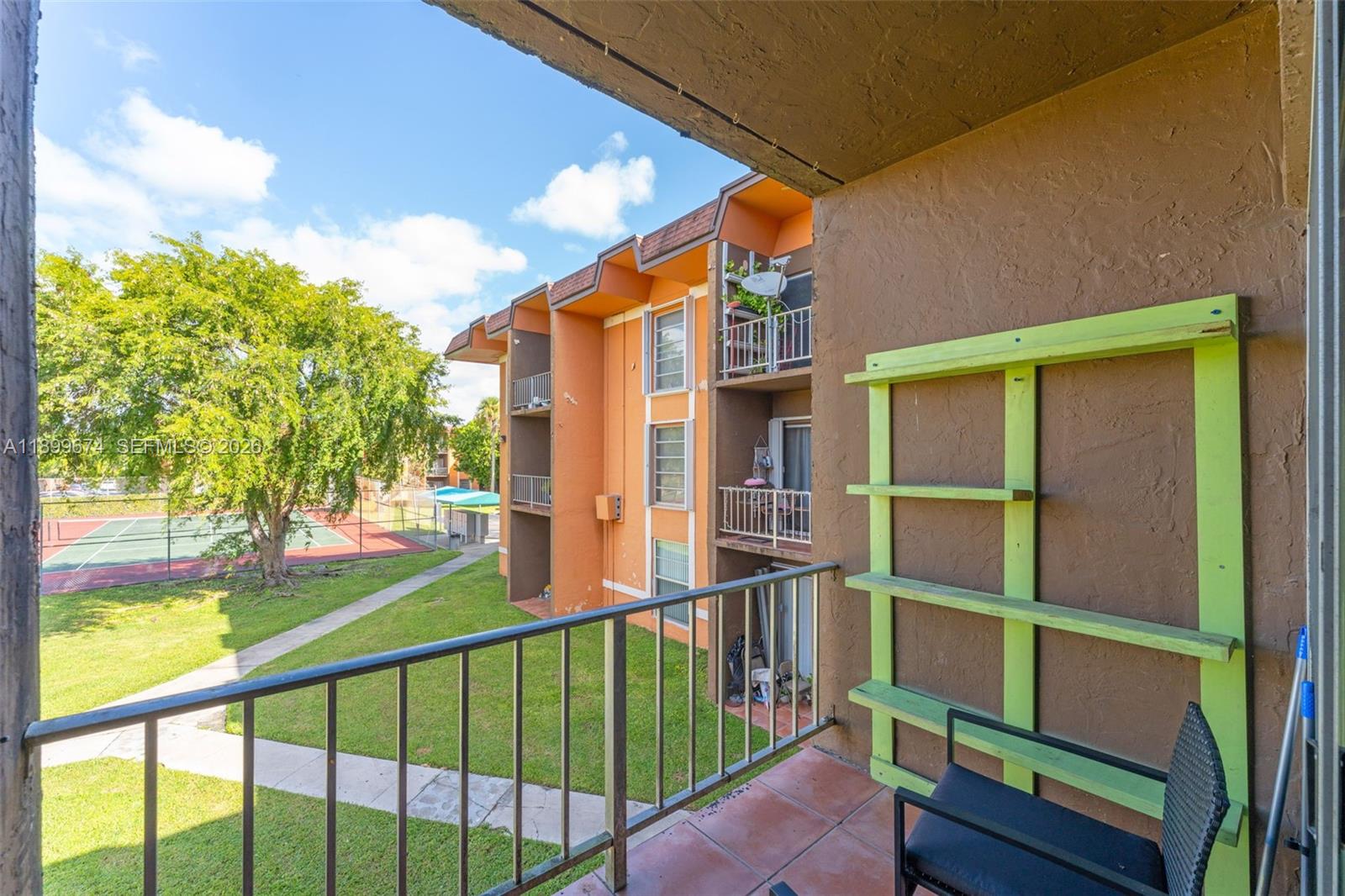 9437 Southwest 76th Street, Unit V25 Miami, FL 33173 - Photo 23 of 30 a view of a house with a deck