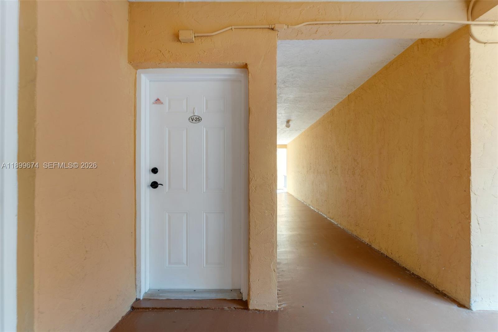 9437 Southwest 76th Street, Unit V25 Miami, FL 33173 - Photo 24 of 30 a view of a hallway