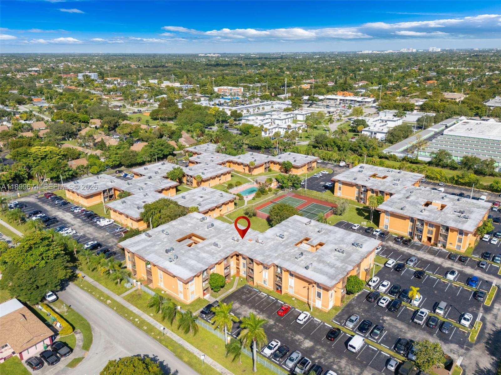 9437 Southwest 76th Street, Unit V25 Miami, FL 33173 - Photo 27 of 30 an aerial view of residential houses with outdoor space