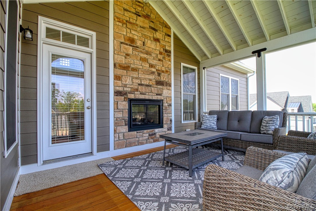 3825 Bircham Loop Midlothian, VA 23113 - Photo 35 of 38 Screened in porch w/ vaulted ceiling & stone firep