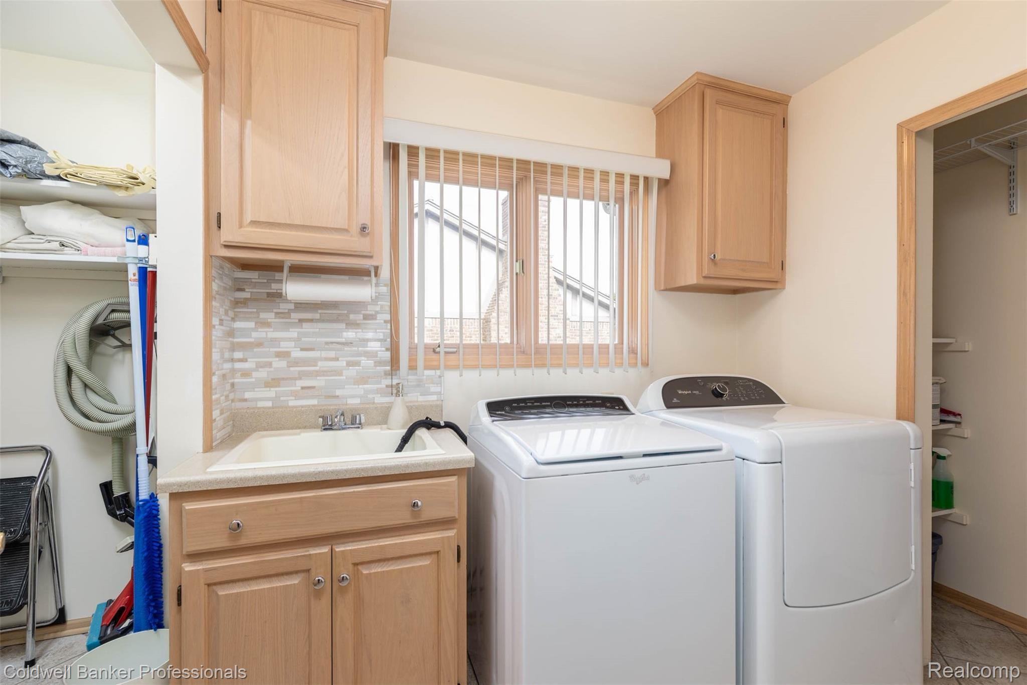 2040 Reagan Drive Rochester, MI 48309 - Photo 25 of 42 First Floor Laundry with Additional Storage Closets