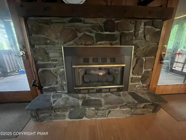 a view of living room with furniture and a floor to ceiling window