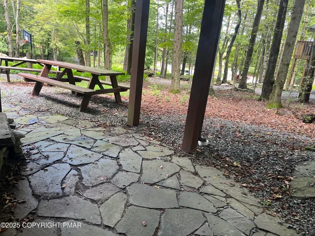 a view of a balcony with wooden floor