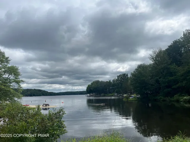 a view of mountain with lake view