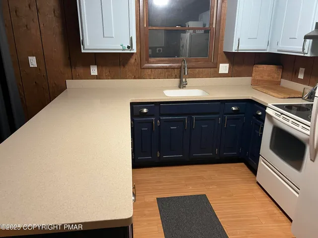 a kitchen with a sink and cabinets