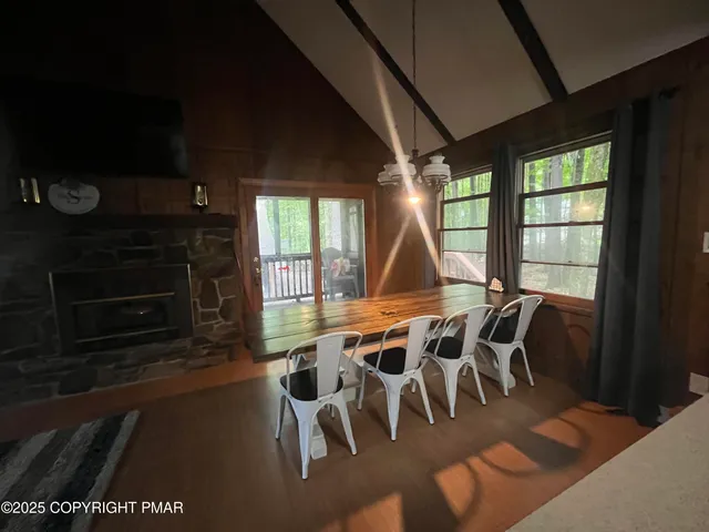 a view of a dining room with furniture window and outside view