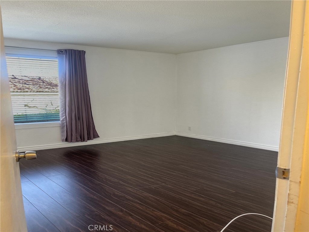 95 Country Mile Road, Unit 245 Pomona, CA 91766 - Photo 11 of 19 wooden floor in an empty room