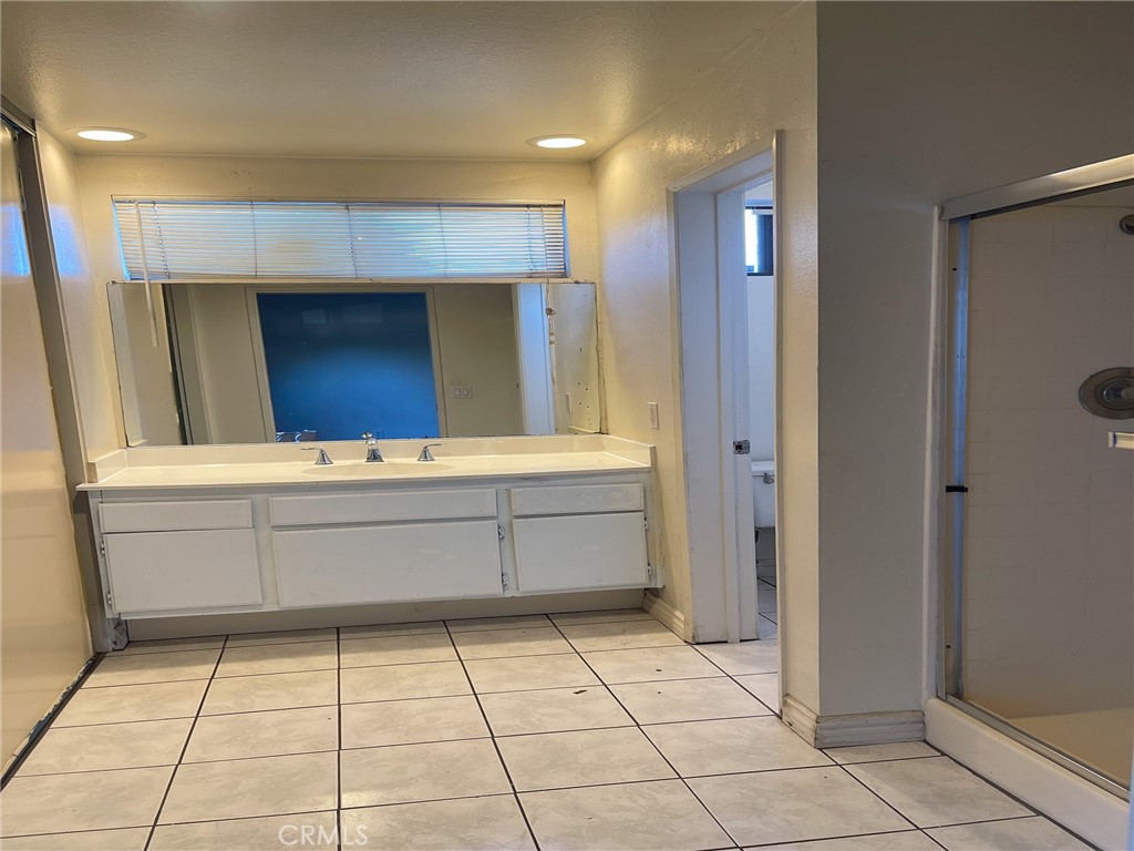 95 Country Mile Road, Unit 245 Pomona, CA 91766 - Photo 16 of 19 a kitchen with stainless steel appliances a sink and a refrigerator