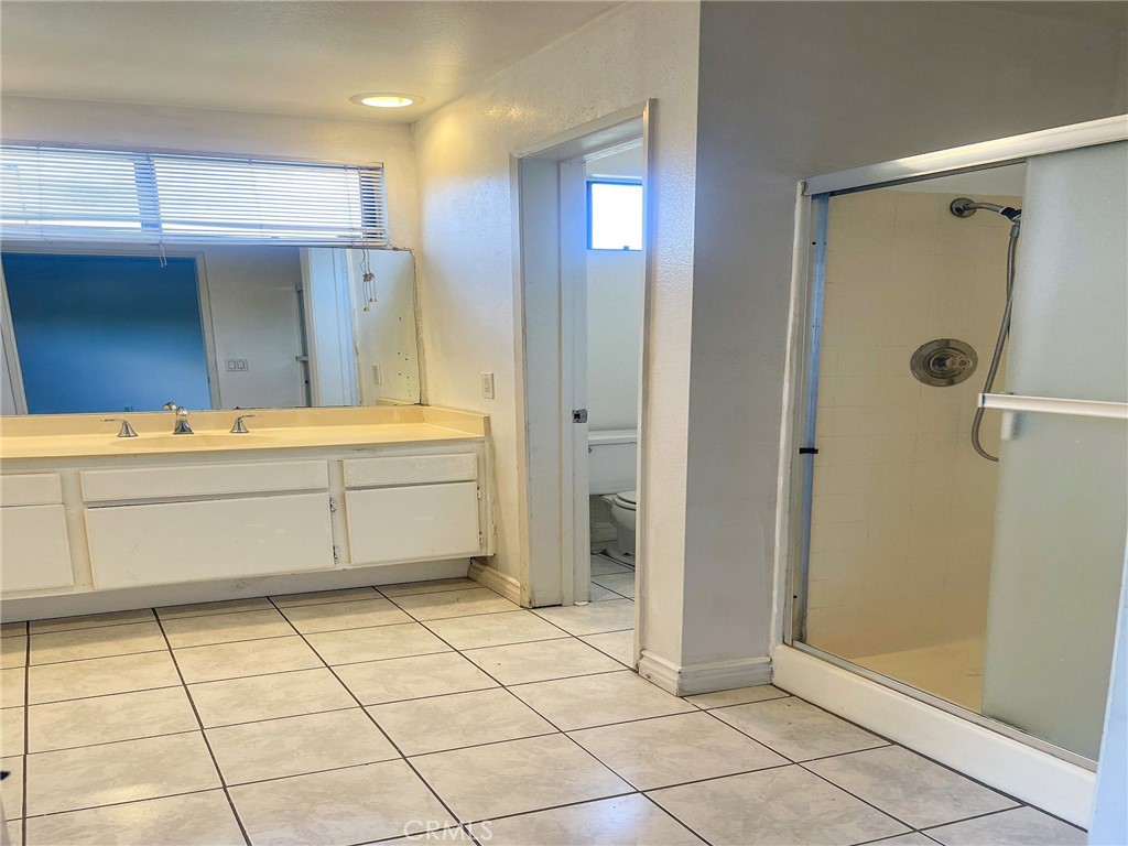 95 Country Mile Road, Unit 245 Pomona, CA 91766 - Photo 18 of 19 a view of walk in closet with white walls