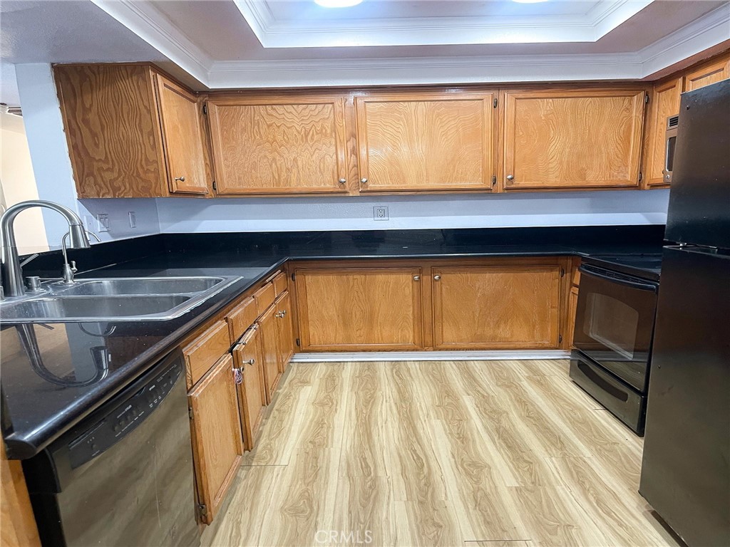 95 Country Mile Road, Unit 245 Pomona, CA 91766 - Photo 3 of 19 a kitchen with a sink and cabinets