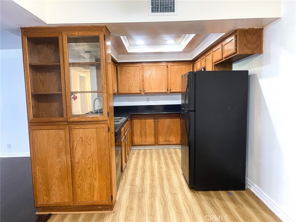 95 Country Mile Road, Unit 245 Pomona, CA 91766 - Photo 4 of 19 a view of a refrigerator in kitchen and a window