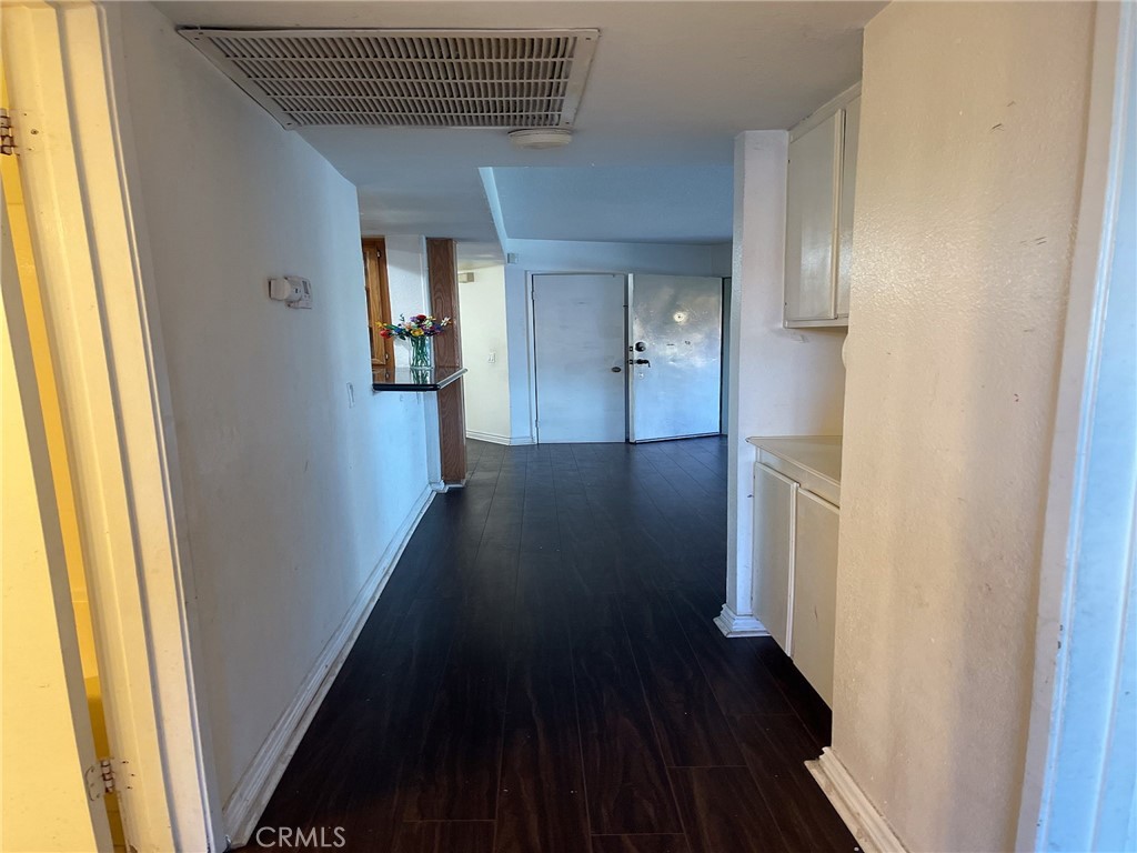 95 Country Mile Road, Unit 245 Pomona, CA 91766 - Photo 9 of 19 a view of a hallway with wooden floor