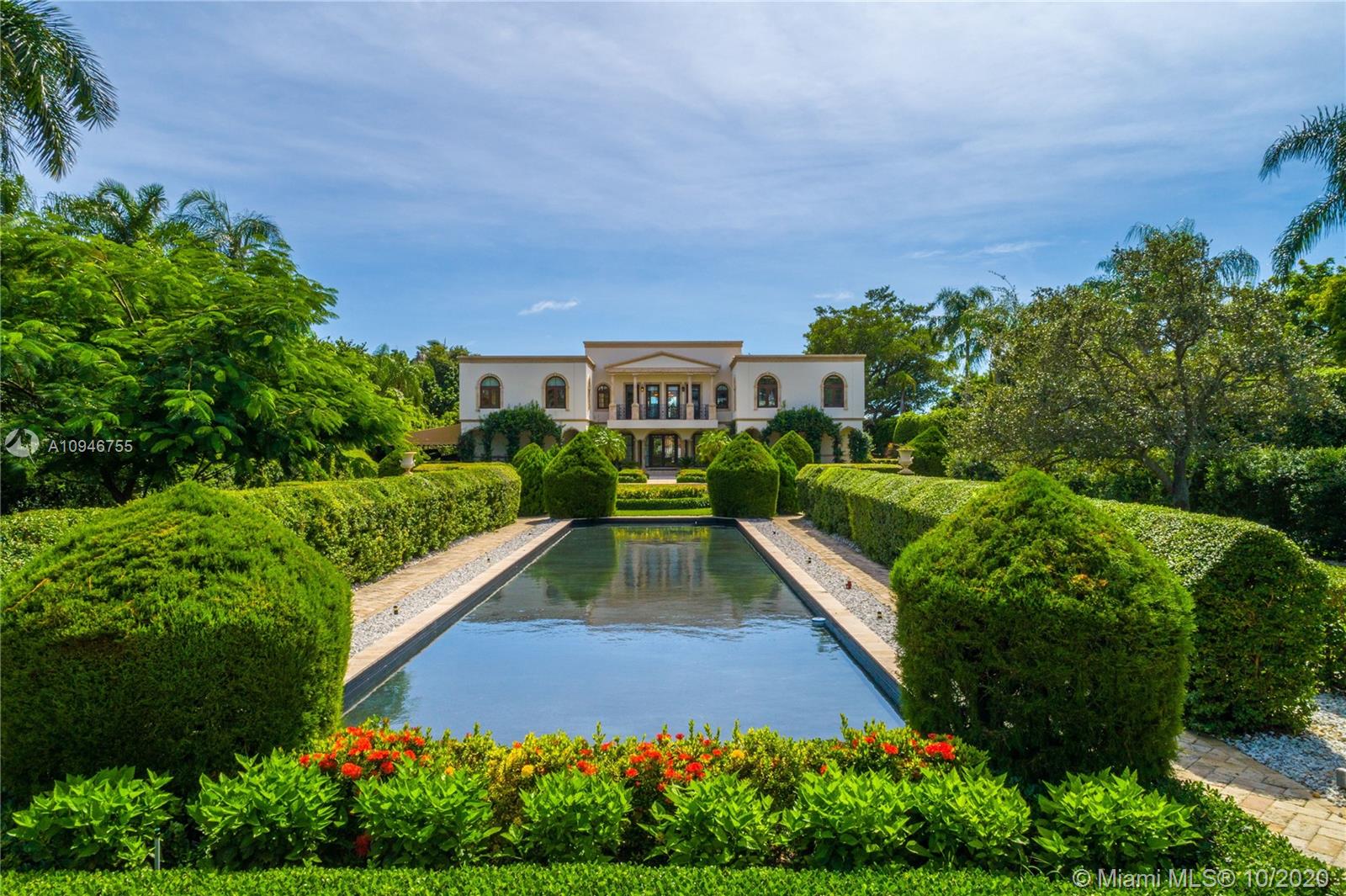 a view of house with yard and swimming pool