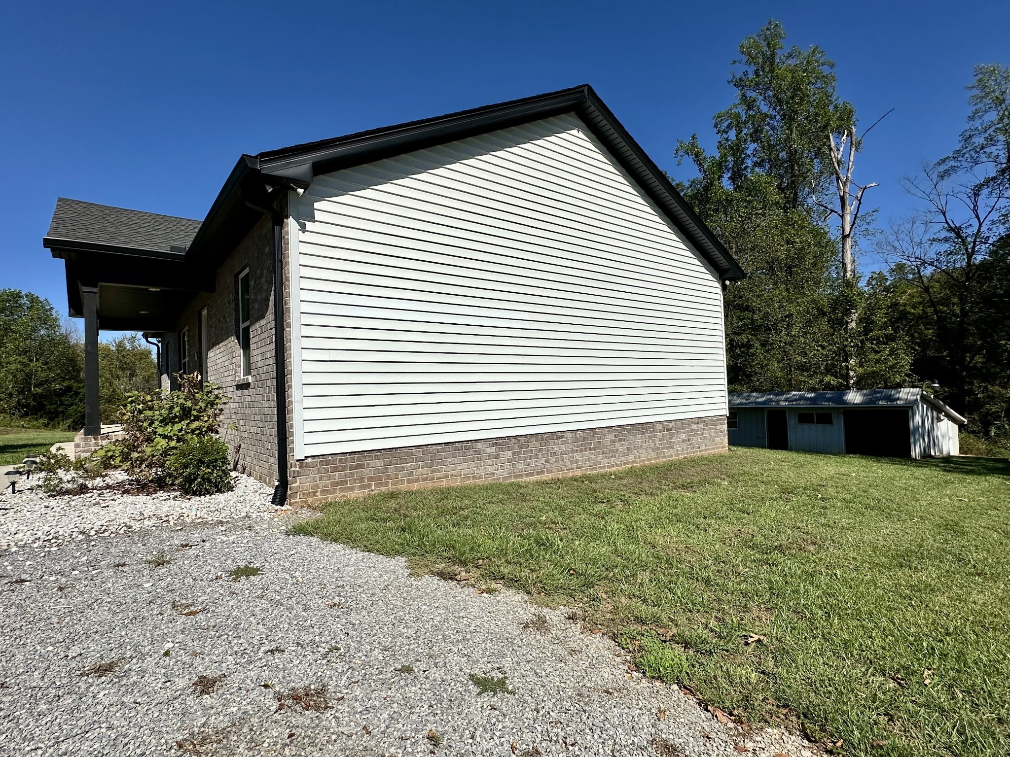 360 Coker Ford Road Portland, TN 37148 - Photo 11 of 46 a view of backyard of house and garage