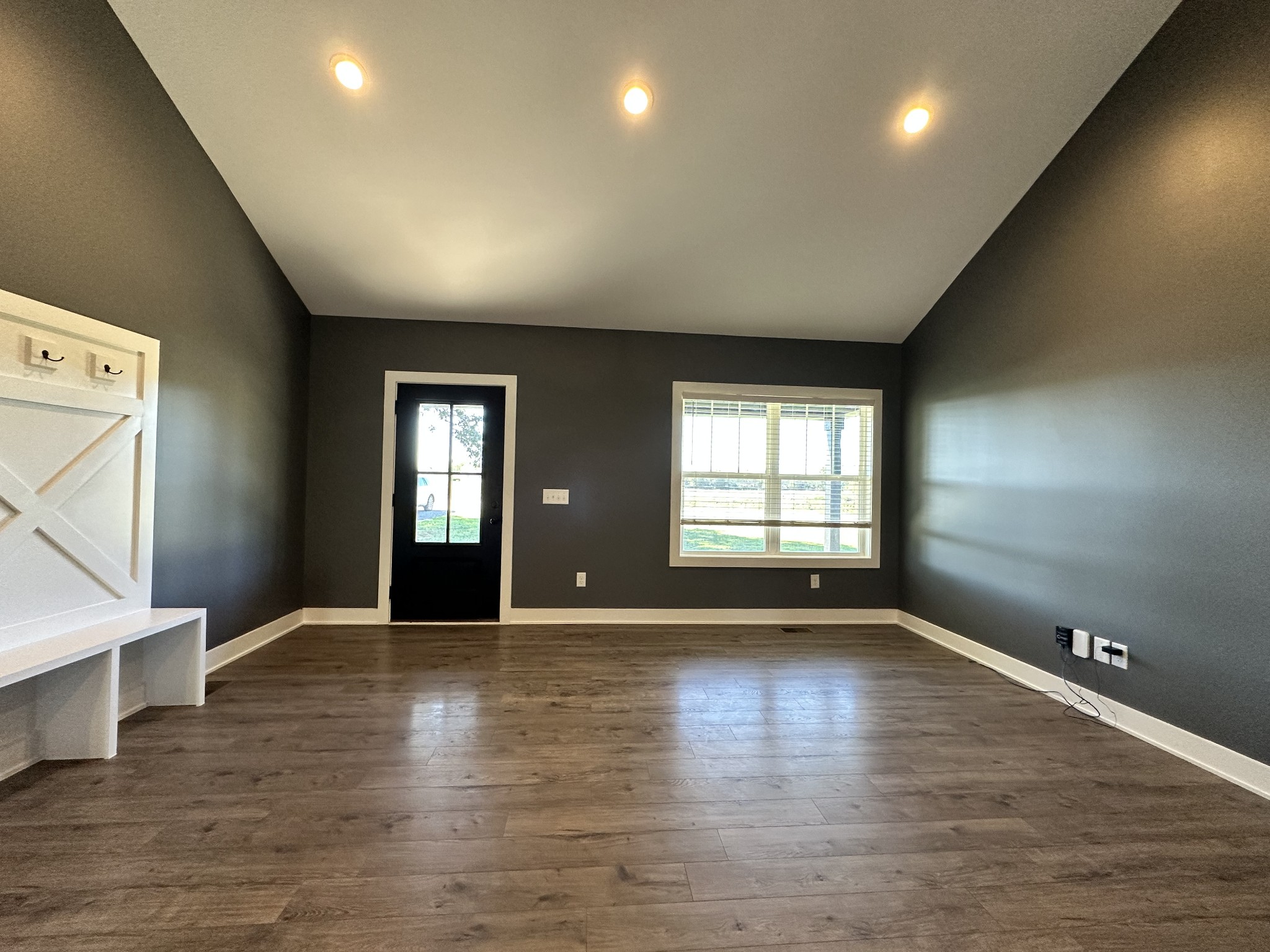 360 Coker Ford Road Portland, TN 37148 - Photo 25 of 46 an empty room with wooden floor and windows