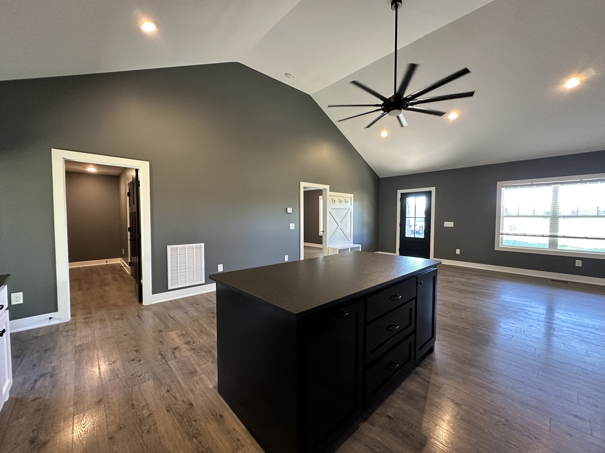 360 Coker Ford Road Portland, TN 37148 - Photo 30 of 46 a kitchen with kitchen island white cabinets appliances and wooden floor