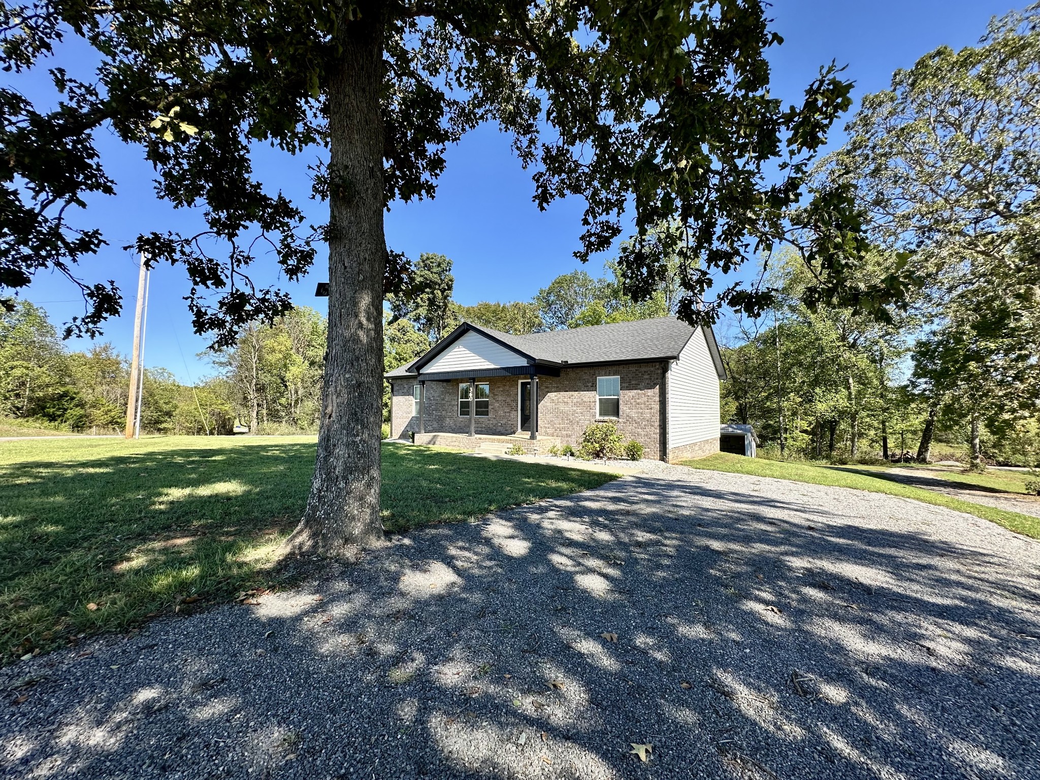360 Coker Ford Road Portland, TN 37148 - Photo 3 of 46 a front view of a house with garden