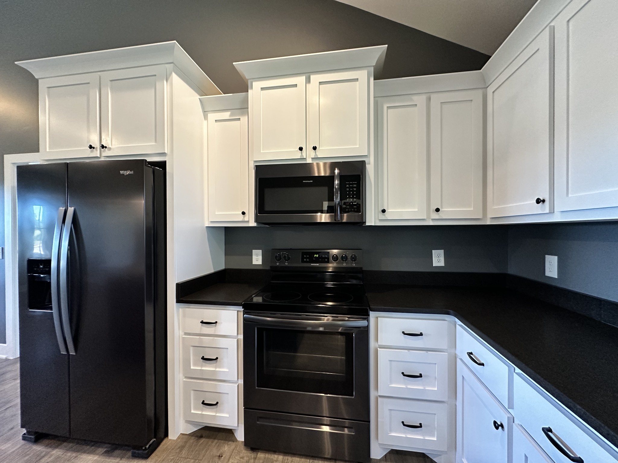 360 Coker Ford Road Portland, TN 37148 - Photo 31 of 46 a kitchen with granite countertop white cabinets and stainless steel appliances