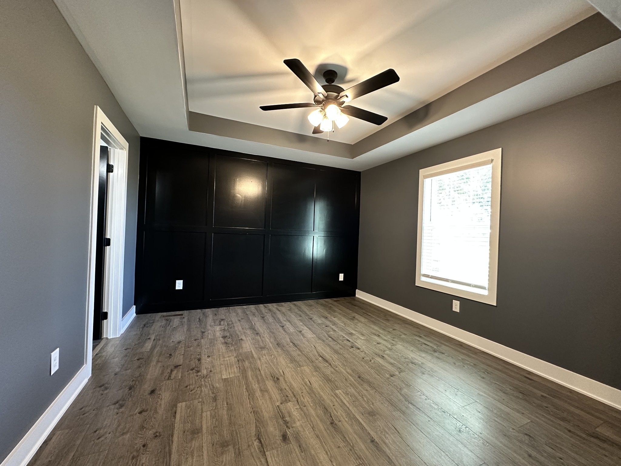 360 Coker Ford Road Portland, TN 37148 - Photo 39 of 46 a view of an empty room with wooden floor and a window