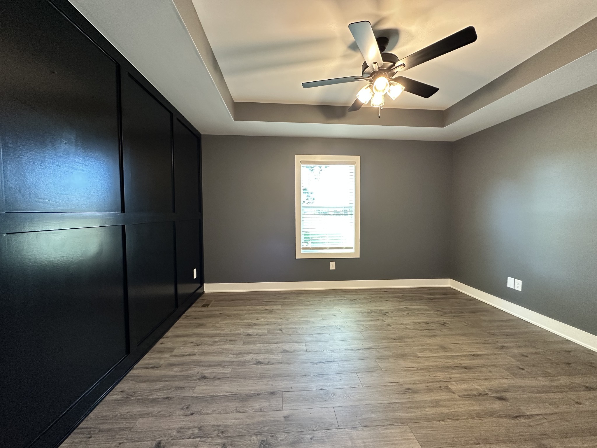 360 Coker Ford Road Portland, TN 37148 - Photo 40 of 46 wooden floor in an empty room with a window