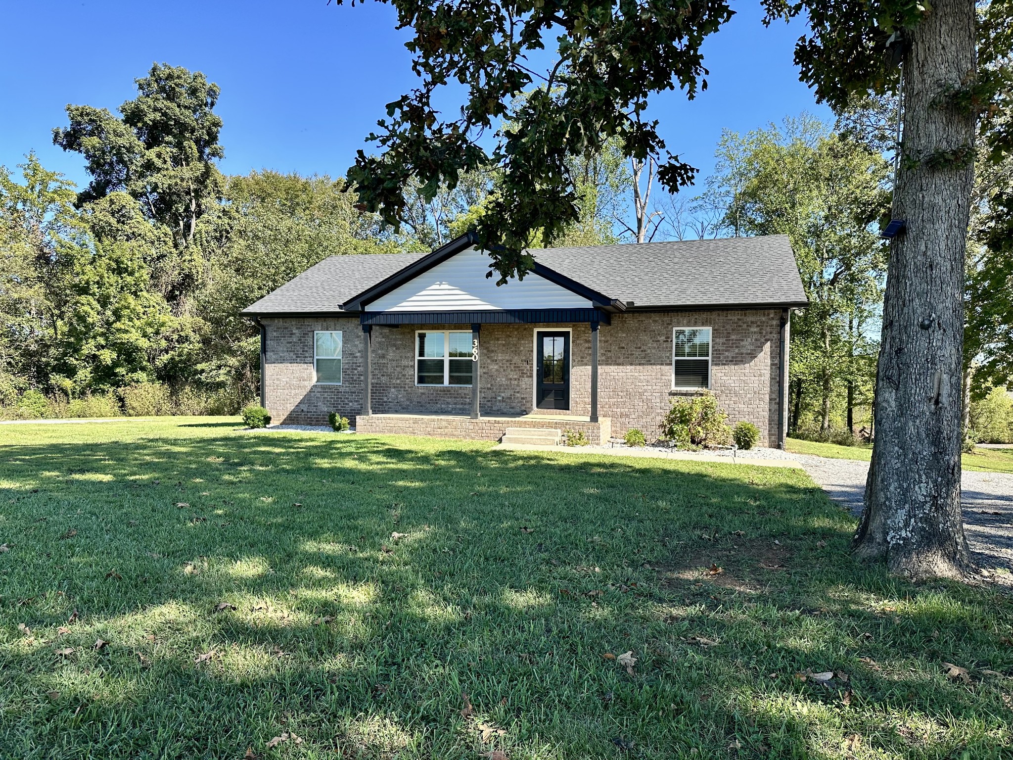 360 Coker Ford Road Portland, TN 37148 - Photo 4 of 46 a front view of a house with a garden