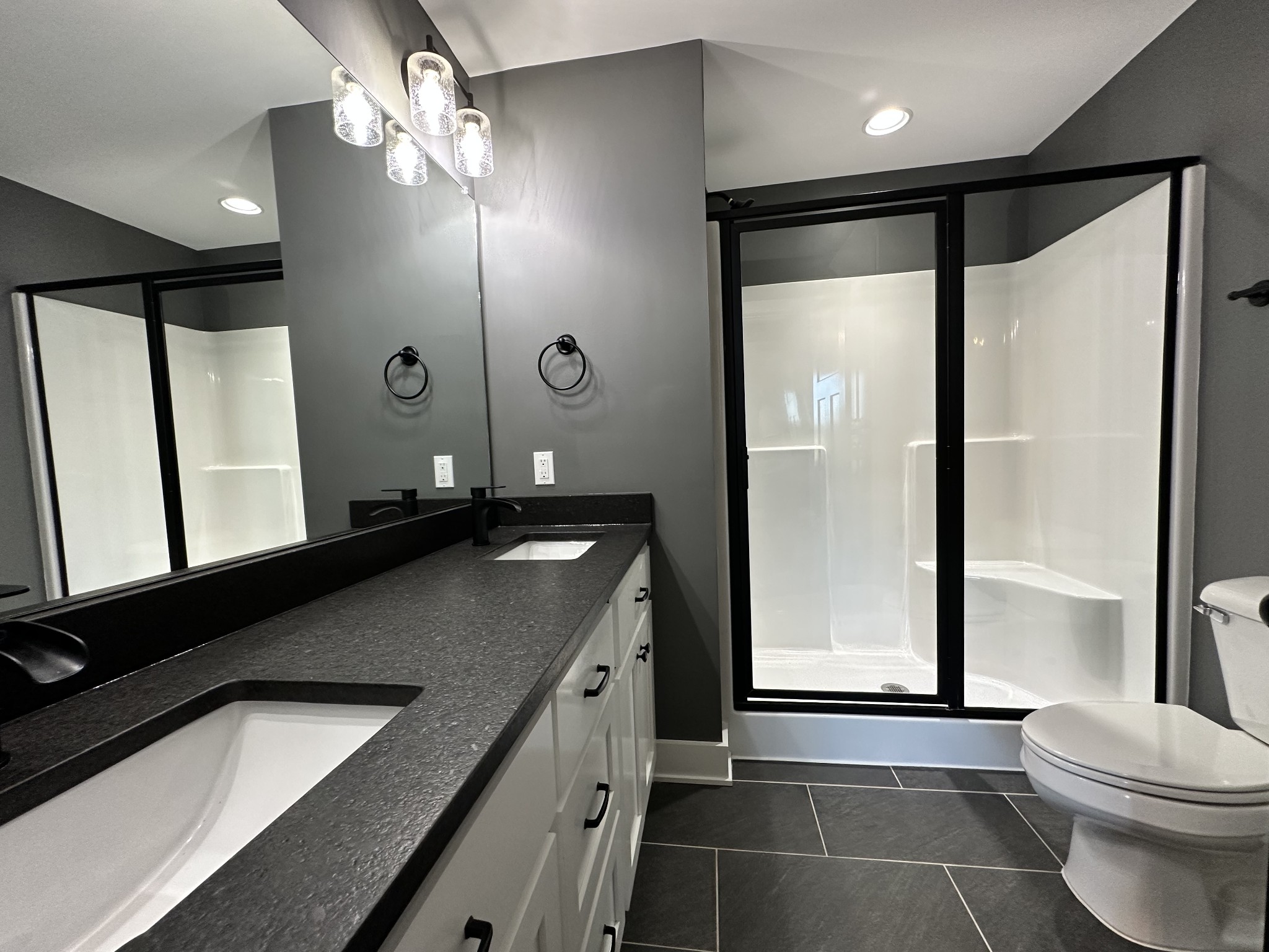 360 Coker Ford Road Portland, TN 37148 - Photo 42 of 46 a bathroom with a double vanity sink toilet and shower