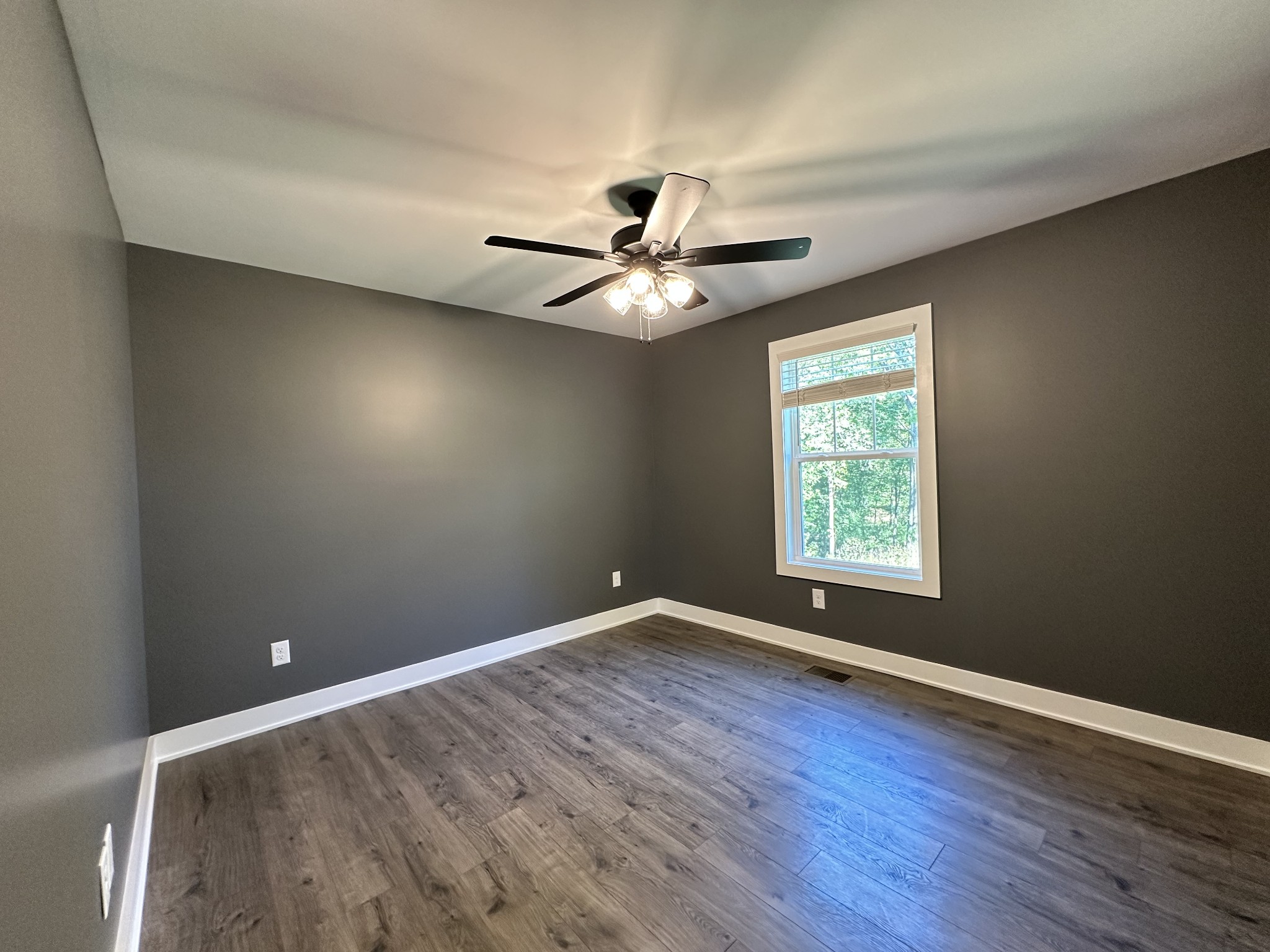 360 Coker Ford Road Portland, TN 37148 - Photo 45 of 46 wooden floor in an empty room with a window