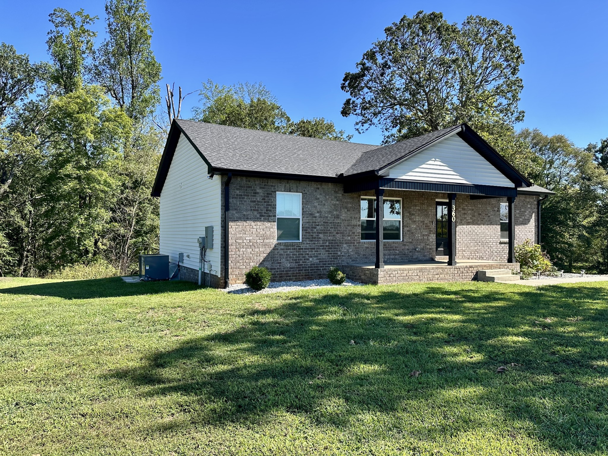 360 Coker Ford Road Portland, TN 37148 - Photo 5 of 46 a front view of a house with a garden